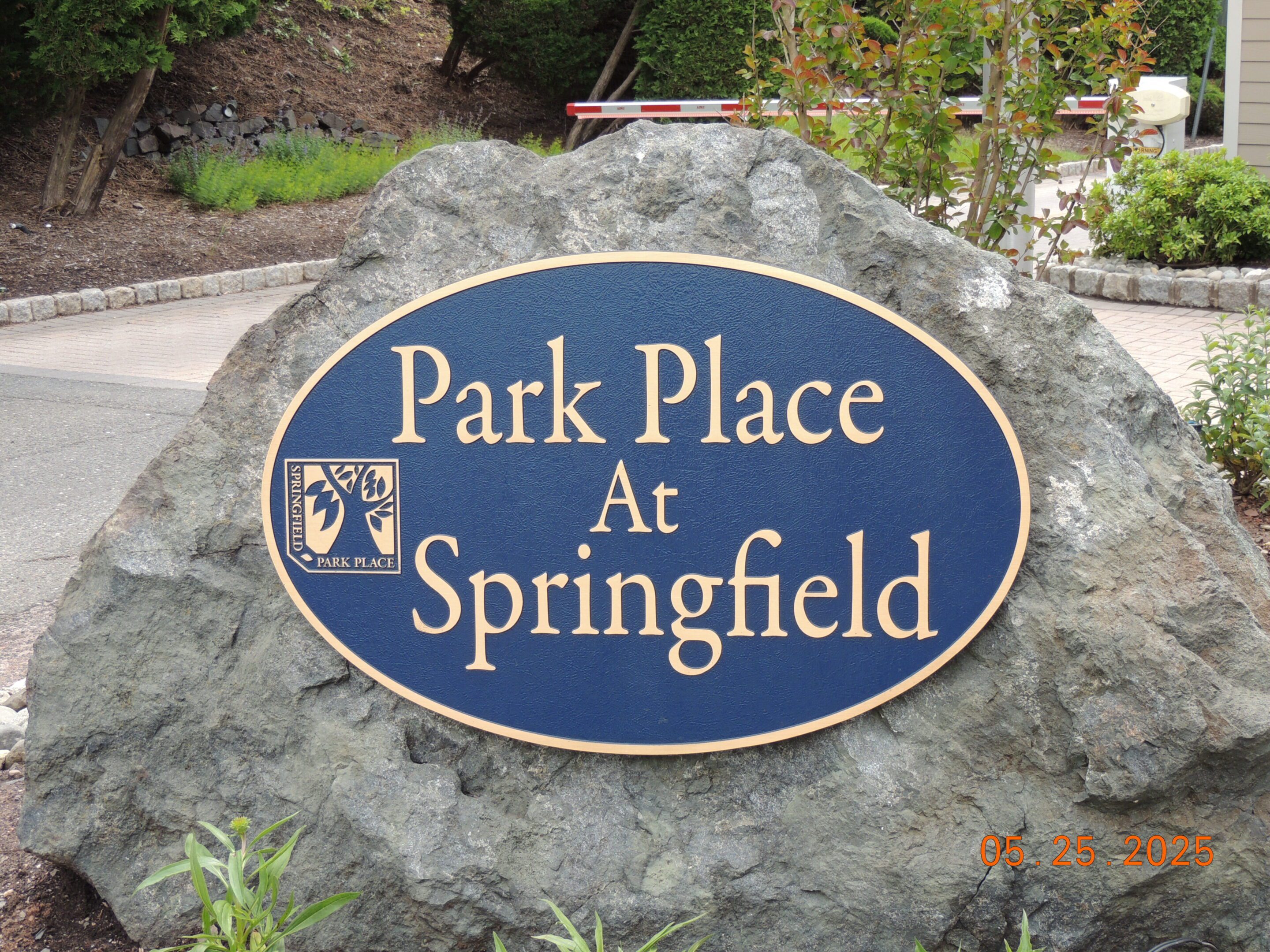 A stone marker with a blue and gold sign reads "Park Place At Springfield." The date on the photo is May 25, 2025.